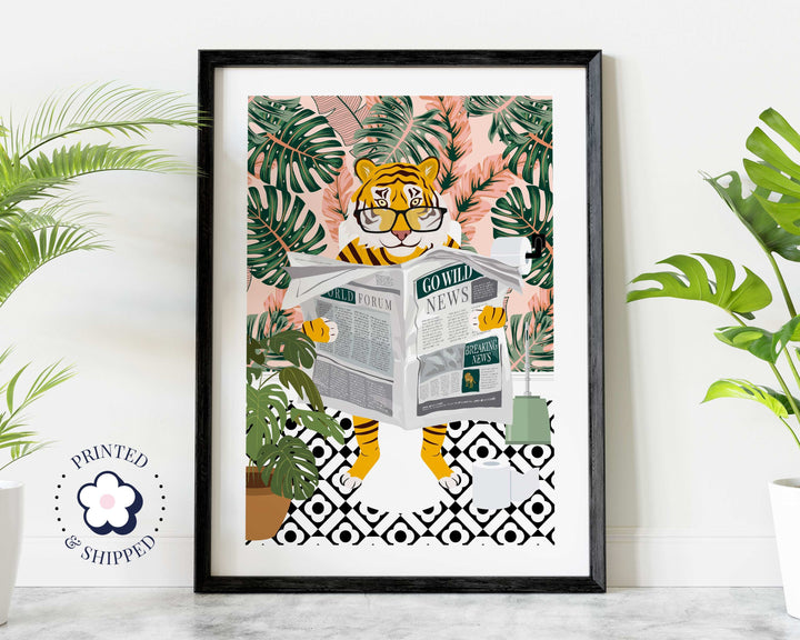 Tiger wearing reading glasses who is sitting on the toilet reading the newspaper.  The tiger is in a colourful botanical pink bathroom with geometric tiled floor surrounded by house plants.