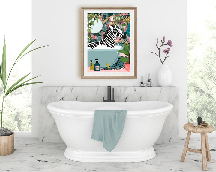 A colourful print showing a zebra relaxing in a bathtub in a bright botanical bathroom.  This maximalist animal in a bath wall art with a tropical safari jungle feel is perfectly suited to a quirky eclectic home adding humour and whimsical fun.