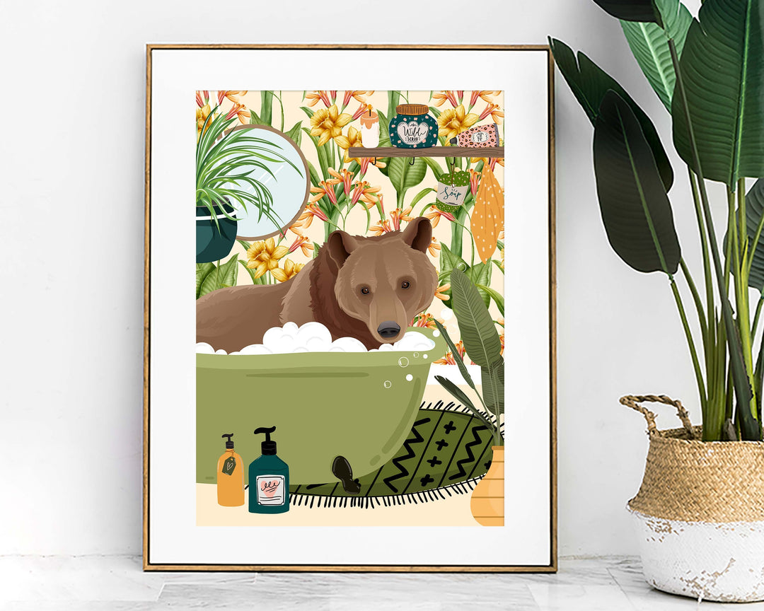 A quirky animal art print of a funny brown bear relaxing in the bathtub in a colourful botanical bathroom.  This modern abstract animal wall art would look great in a kids bathroom, nursery or playroom which has a fun animal or cottage core theme.